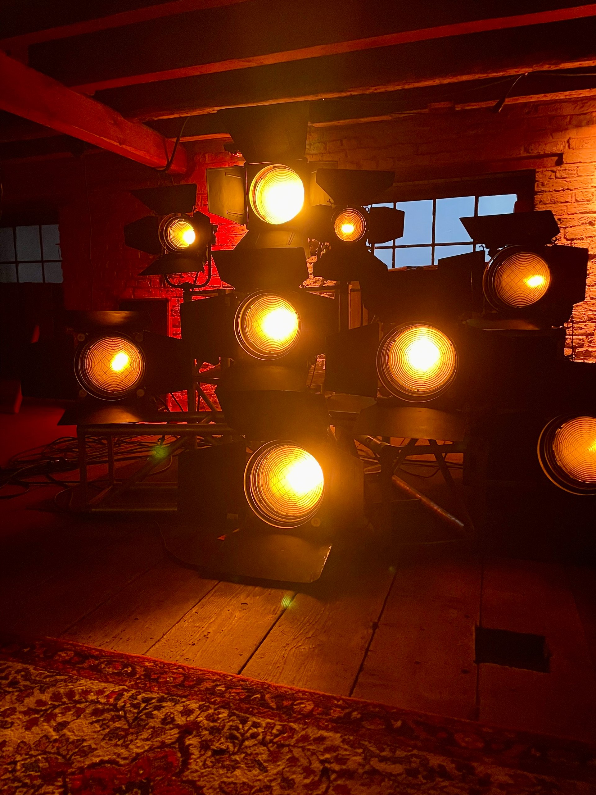 Warm stage-light study for the fictional KALI example profile
